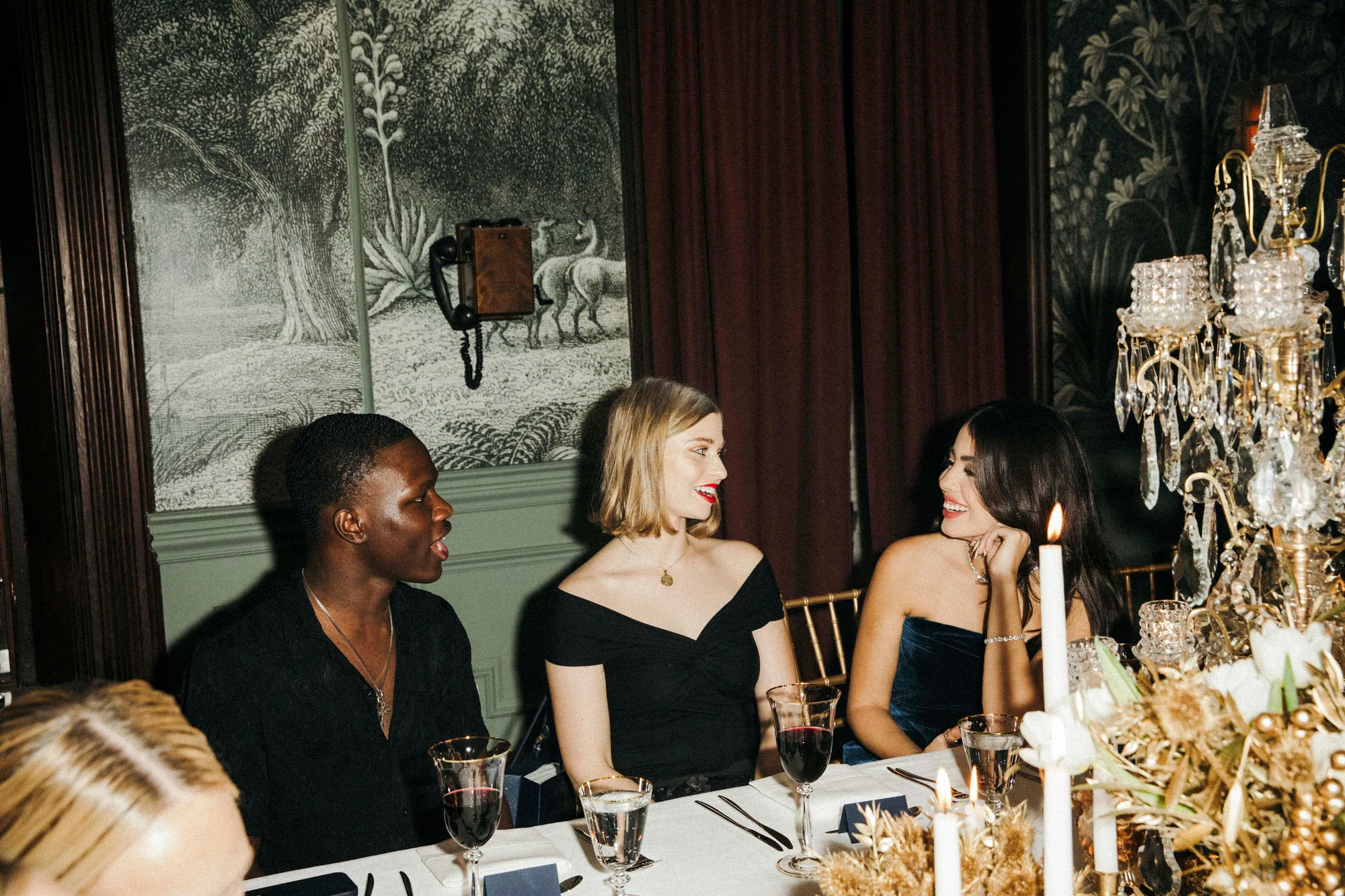Diptych of candlelit dinner party scenes