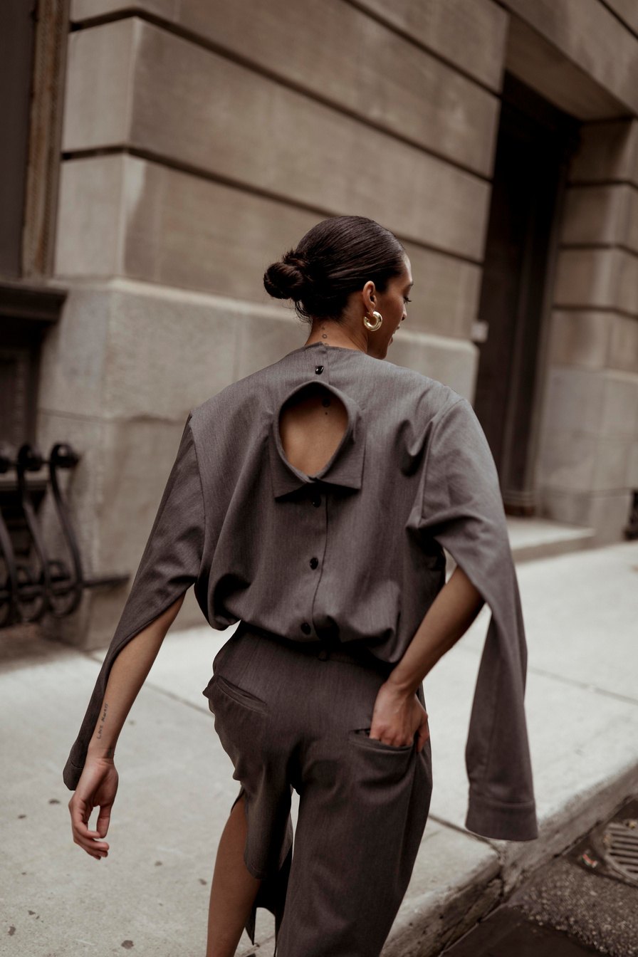 Model in a grey cut-out suit