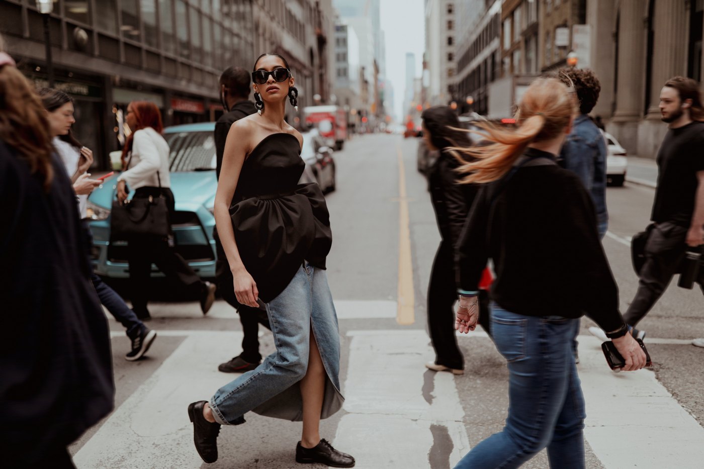 Model crossing a busy street