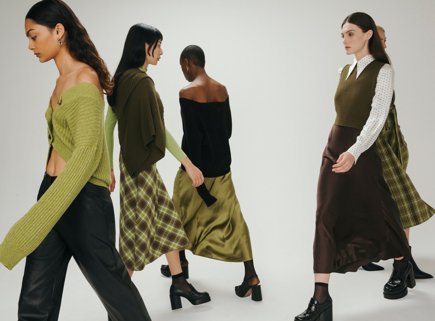 Models walking in green and brown looks